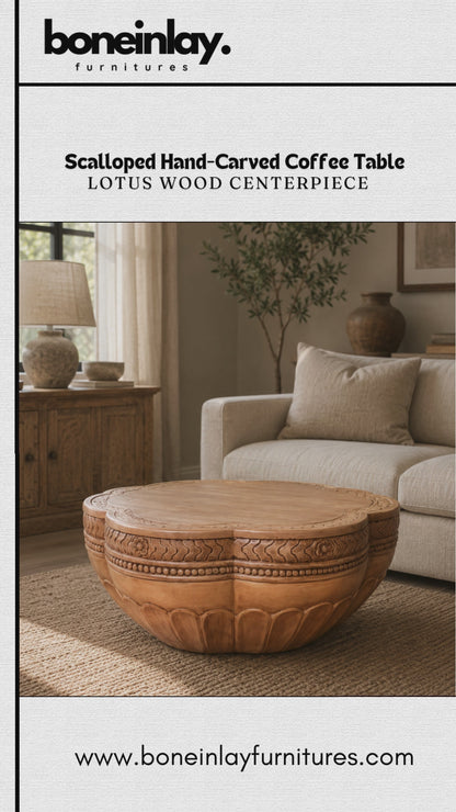 Hand Carved Coffee Table Made From Solid Natural Wood. The Unique Lotus Flower Shaped Design Features A Smooth Flat Top Surface Resting Above An Intricately Carved Base Detailed With Traditional Border Motifs. Finished In A Warm Natural Wood Tone, This Low Profile Centerpiece Perfectly Balances Rustic Charm With Elegant Artistry.