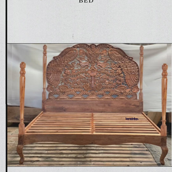 This video presents a custom "Woodland Four Poster Bed," featuring a solid wood frame with a rich, natural finish. The headboard is the centerpiece, boasting intricate, hand-carved floral and nature-inspired motifs that create a grand, statement look. A person's hand touches the tall, smooth corner post to emphasize the bed's stature and robust build, highlighting its blend of traditional artistry and sturdy craftsmanship.