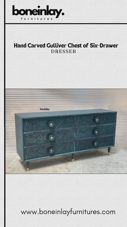 its natural, light-wood finish and intricate hand-carved floral patterns that cover the entire front surface. The video then transitions to a cinematic pan of the dresser in a workshop setting, providing a closer look at the organic texture and artisan detail.