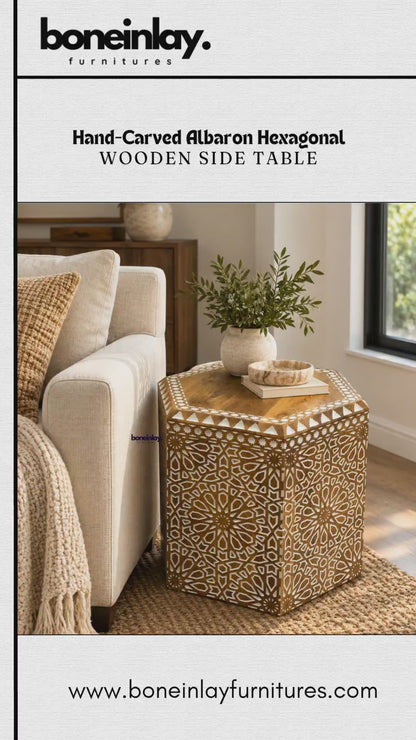 The video showcases a hand-carved Albaron hexagonal wooden side table from Bone Inlay Furnitures. The table features intricate geometric and floral patterns with a polished wooden top and decorative borders. It is displayed in a brightly lit interior setting next to a sofa and later shown independently on a stone floor.