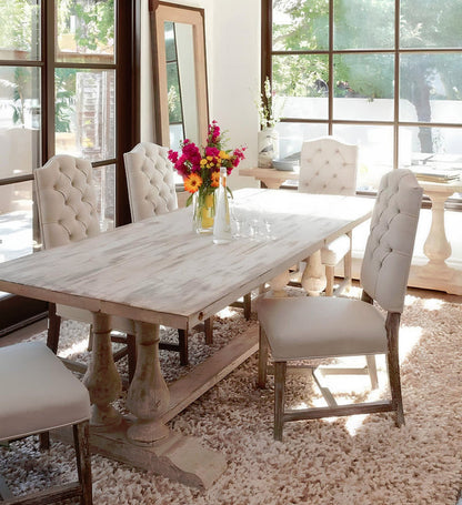 Handcrafted solid wood double pedestal trestle dining table with baluster legs in distressed whitewash finish.