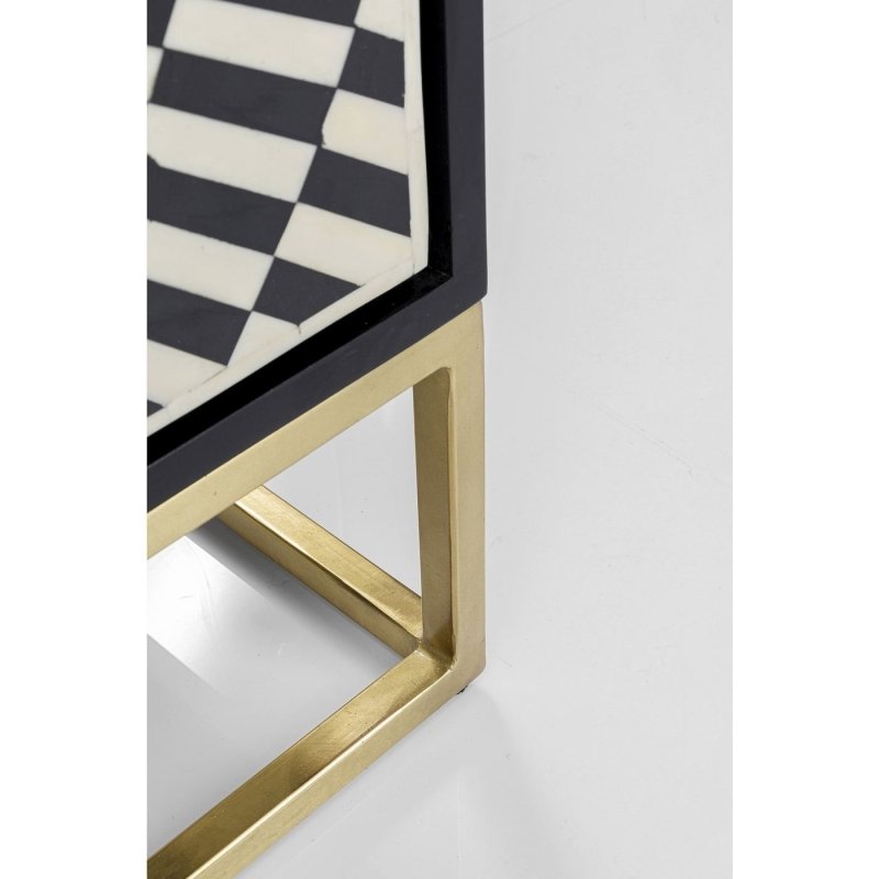 Zoomed detail of starburst bone inlay sideboard door panel showing radiating fan-shaped black and white inlay pattern with black wooden frame hinge area
