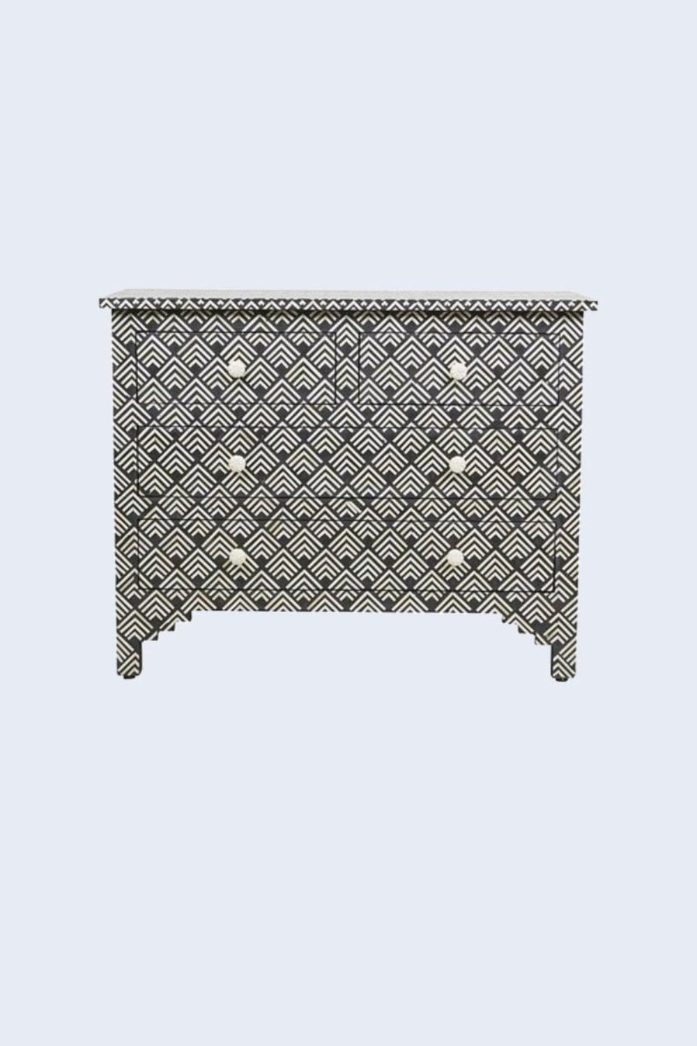 Ivory and black bone inlay bureau with four drawers, geometric fan pattern, and round ivory knobs in a three-quarter view.
