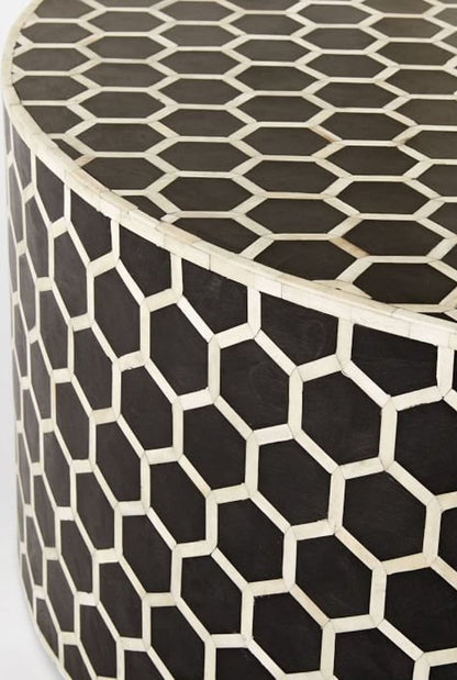 Close-up view of the black bone inlay honeycomb pattern on a handmade round coffee table, showing the geometric hexagon detailing across the surface.