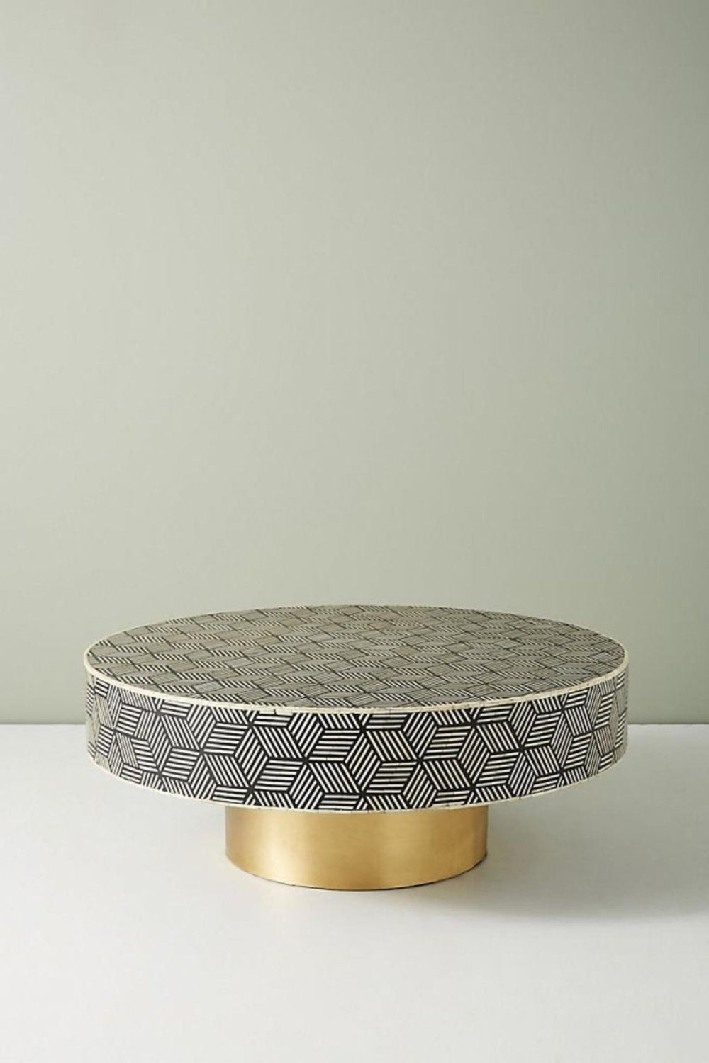 Black Bone Inlay Round Table with brass base, shown from the front with its patterned surface and circular design.