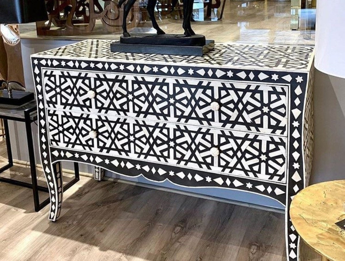 Black Geometric Inlay Buffet with two drawers and slim curved legs, viewed nearly straight on in a furnished room.