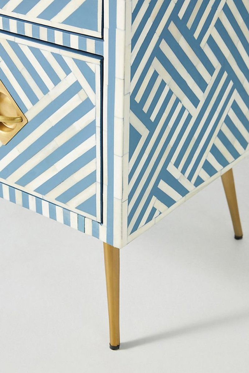 Blue Optical Cabinet with white bone inlay, shown at the front-right corner with a patterned side panel and brass leg.