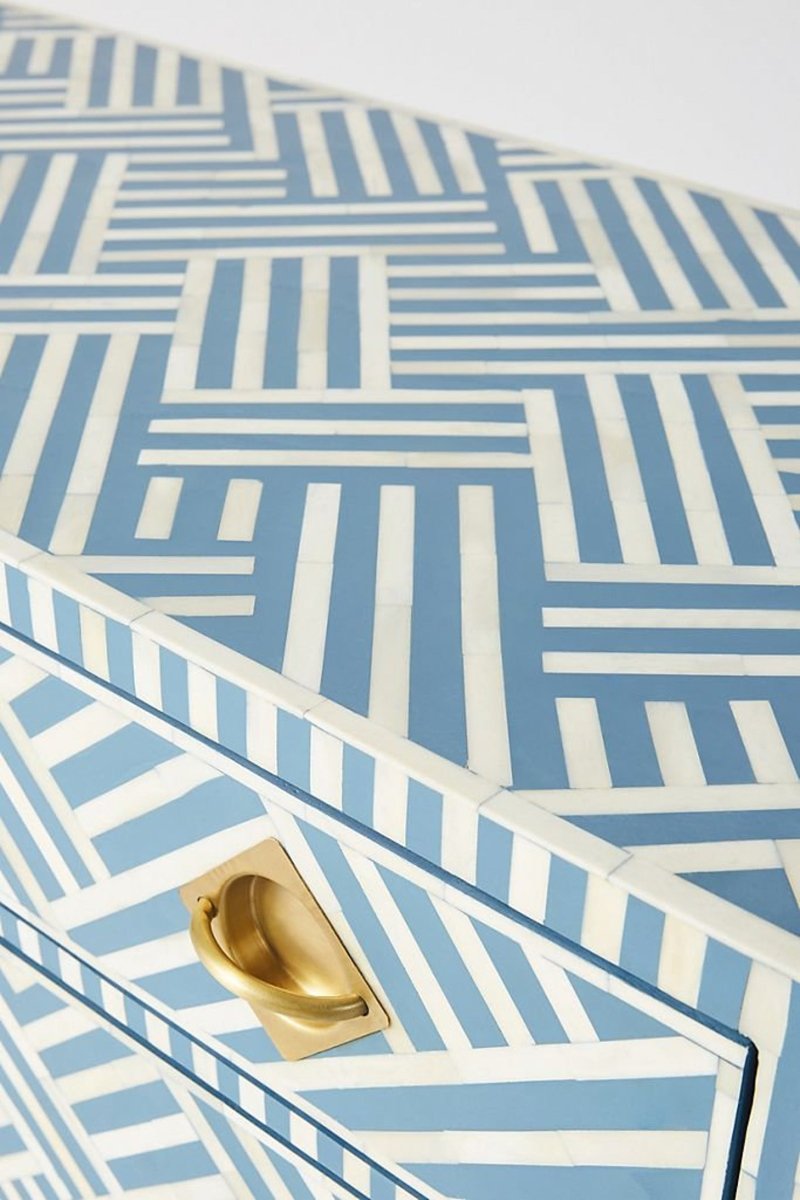 Blue Patterned Cabinet with white bone inlay, shown in a close-up of the top corner, drawer front, and brass pull.