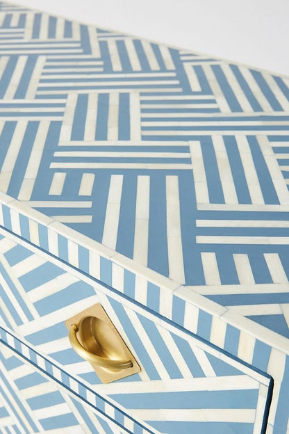 Blue Patterned Cabinet with white bone inlay, shown in a close-up of the top corner, drawer front, and brass pull.