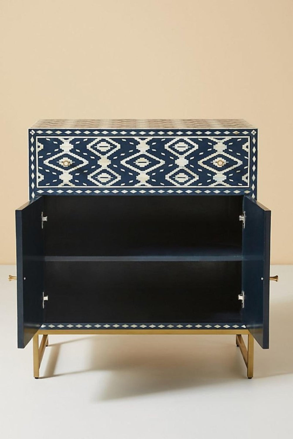 Handmade indigo blue and ivory bone inlay storage cabinet with Ikat pattern, drawer storage, double doors, and metal base.
