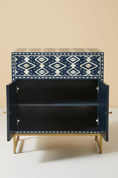 Handmade indigo blue and ivory bone inlay storage cabinet with Ikat pattern, drawer storage, double doors, and metal base.
