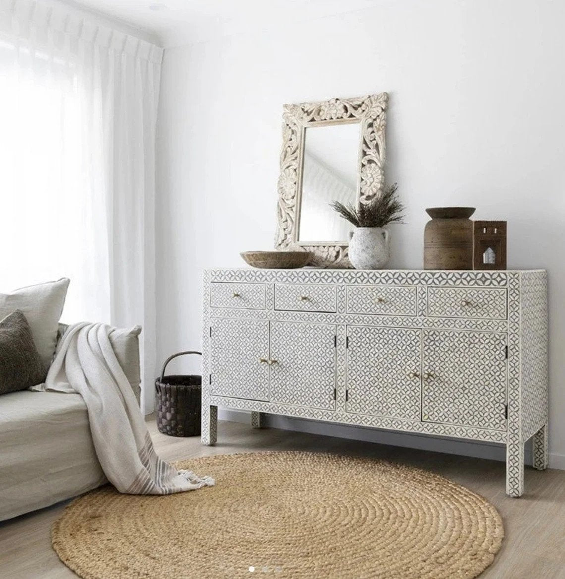 White bone inlay geometric 4 drawer 4 door sideboard buffet table with brass handles, styled in a bright Scandinavian living room