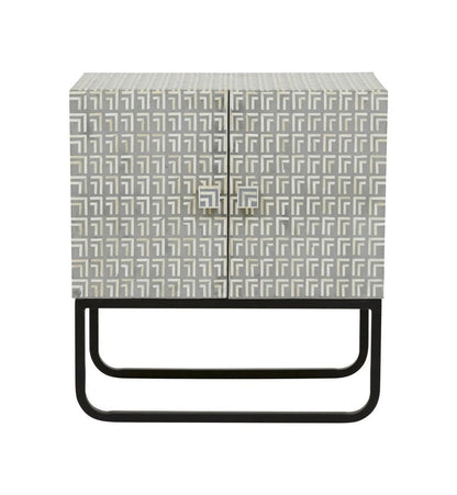 Art Deco grey bone inlay two-door cabinet nightstand with geometric L-pattern inlay and black iron sled base, isolated white background