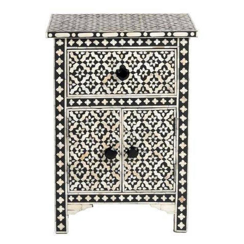 Handcrafted bone inlay bedside table in black and white geometric pattern with drawer, double doors, and decorative knobs