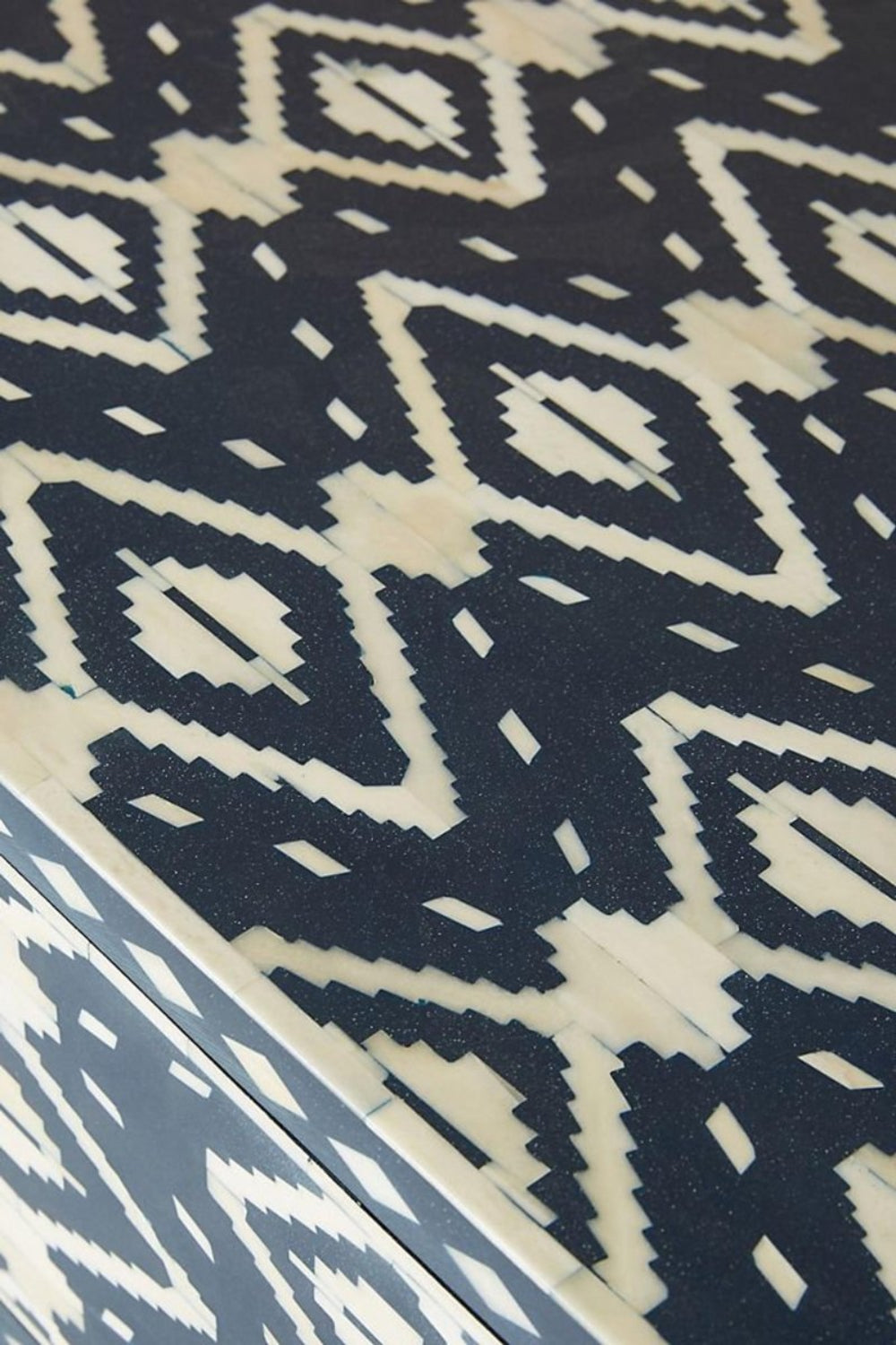 Indigo blue and ivory bone inlay console cabinet with geometric pattern, one drawer, two doors, and a brass-finished base.