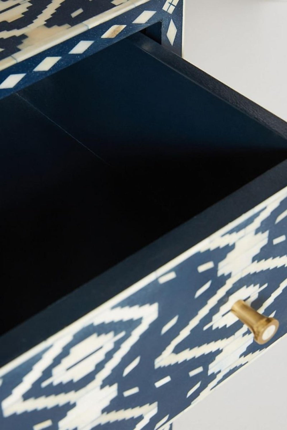 Indigo blue and ivory bone inlay sideboard with an Ikat pattern, spacious drawer, double doors, and a brass-tone metal base.