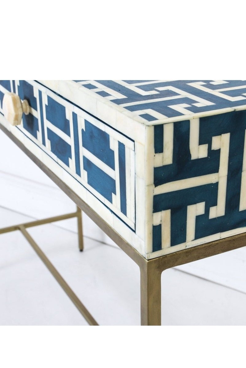 Close-up view of the dark blue bone inlay entry table, focusing on the geometric lattice pattern across the rectangular top and drawer fronts. The detailed crop also shows the two-drawer construction, slim proportions, and gold-toned legs of this handmade console table.