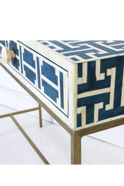 Close-up view of the dark blue bone inlay entry table, focusing on the geometric lattice pattern across the rectangular top and drawer fronts. The detailed crop also shows the two-drawer construction, slim proportions, and gold-toned legs of this handmade console table.