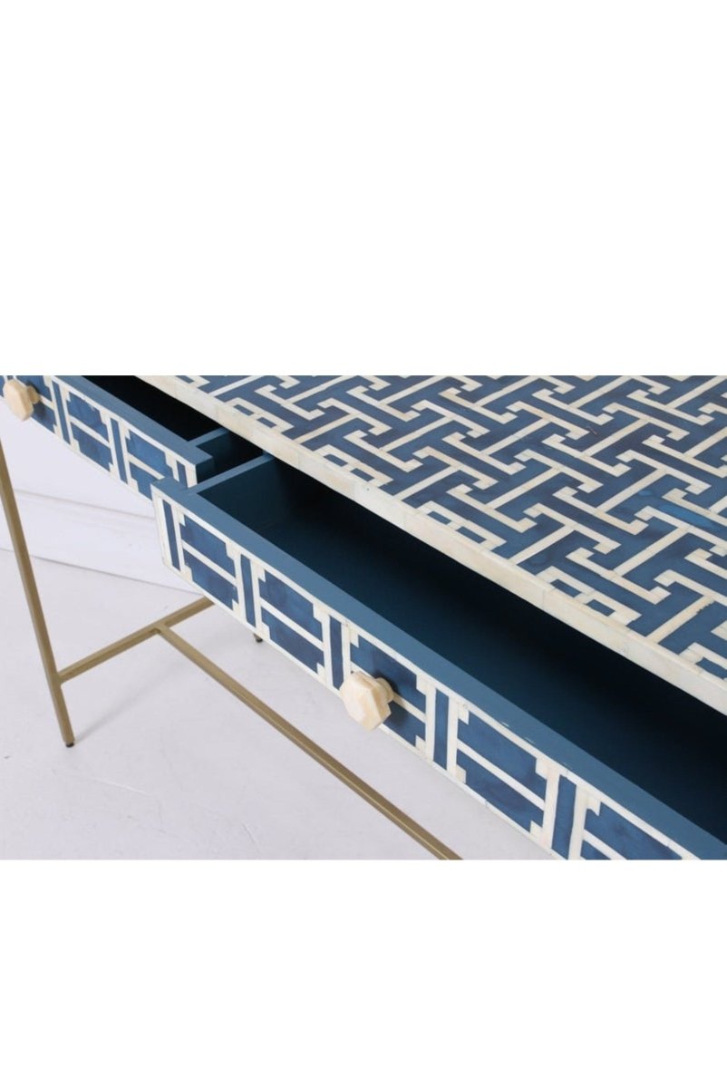 Right front angle of the handmade dark blue bone inlay work desk, displaying the geometric lattice inlay on the top and two built-in drawer fronts. This view shows the wide rectangular work surface, narrow console form, and slim gold-toned legs for a home office.