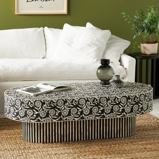 Floral Bone Inlay Coffee Table in black and white, shown in a straight-on front view with the oval top fully visible.