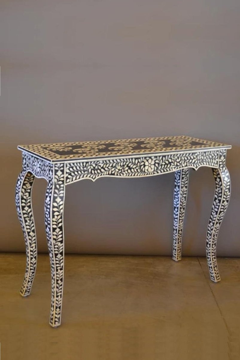 Handmade black bone inlay floral console table in a front angle, showing the contrasting floral vine pattern across the front, curved French-style legs, scalloped lower edge, and narrow silhouette suited to an entryway, hallway, or living room.