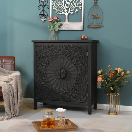 Floral Carved Wood entryway cabinet in black, styled in living room against a teal wall beside a chair and flower vase.