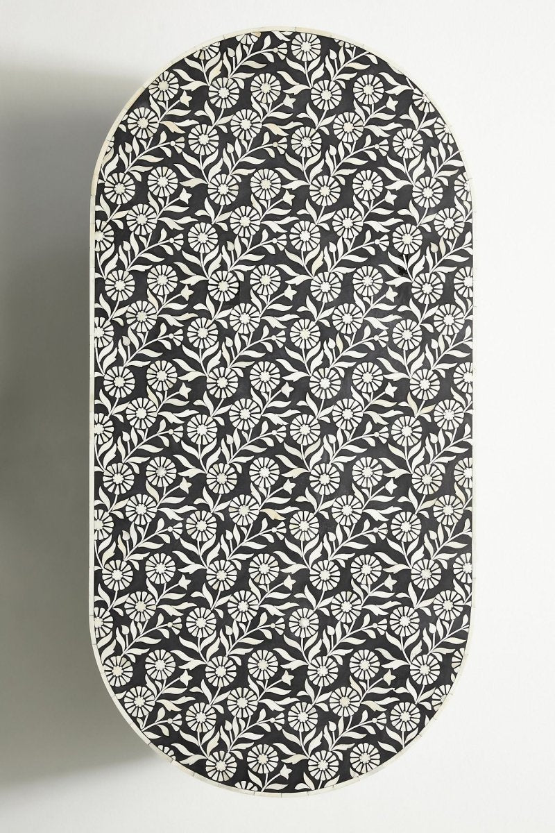 Floral Oval Accent Table in black and white, shown in a close view that highlights the detailed bone inlay surface.