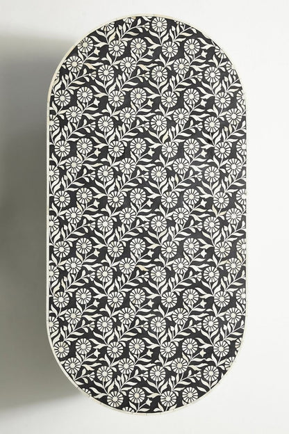 Floral Oval Accent Table in black and white, shown in a close view that highlights the detailed bone inlay surface.