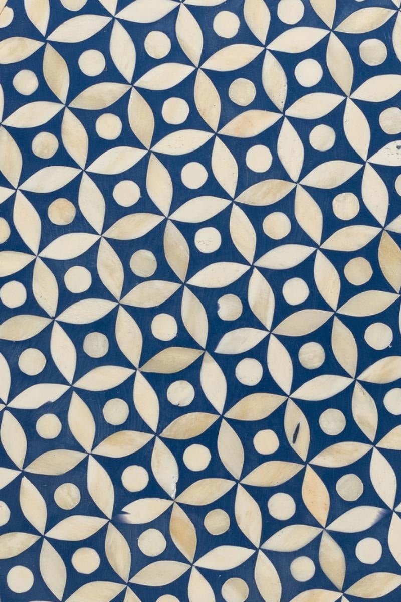 Top view of a blue and white bone inlay nightstand showing the patterned top surface, two-drawer layout, decorative floral knobs, and detailed handcrafted finish.