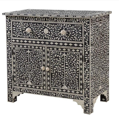 Handmade bone inlay black cupboard with ivory floral vine motifs, notched base, 1 top drawer and 2 lower doors with round bone knobs, solid wood