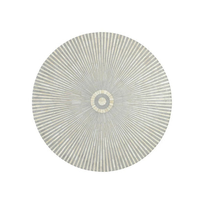 Flat lay of handmade bone inlay round coffee table in soft grey and white sunburst pattern showing full circular tabletop with radiating stripes and center medallion, Indian artisan luxury furniture