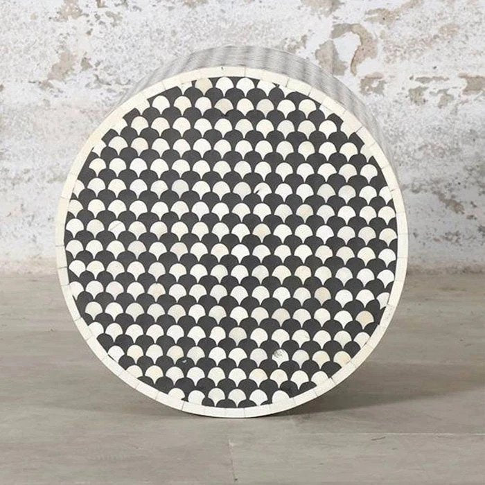 Handmade black and white bone inlay accent stool with repeating geometric inlay, a compact cylindrical form, and versatile use as a side table, plant stand, or occasional seat.