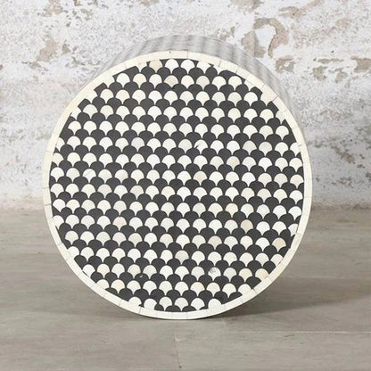 Handmade black and white bone inlay accent stool with repeating geometric inlay, a compact cylindrical form, and versatile use as a side table, plant stand, or occasional seat.