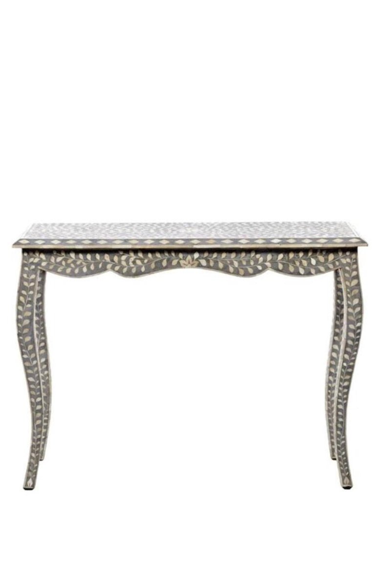 Gray and ivory bone inlay console table shown from a front angle, highlighting the hand-carved floral pattern, scalloped edges, curved legs, patterned tabletop, and decorative base. The work-desk silhouette is styled for a home office, vanity, or entryway.