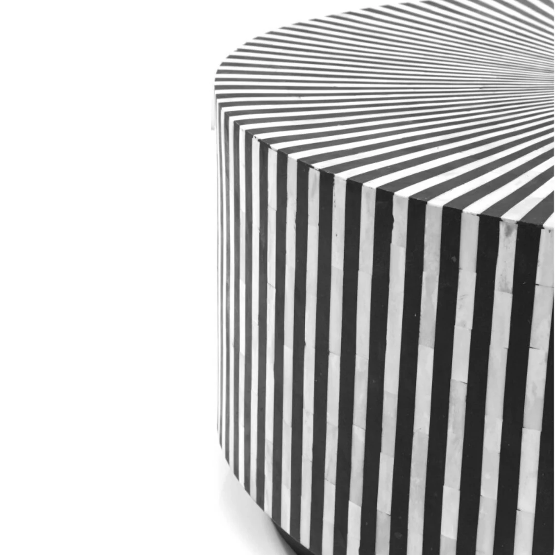 Handmade black and white bone inlay coffee table displaying its striped drum body in a full side product view.
