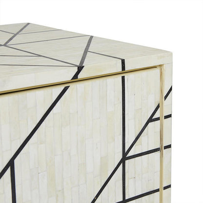 Upper corner detail of ivory bone inlay sideboard with bold black geometric lines, gold brass-toned trim edge and handcrafted mosaic tile craftsmanship