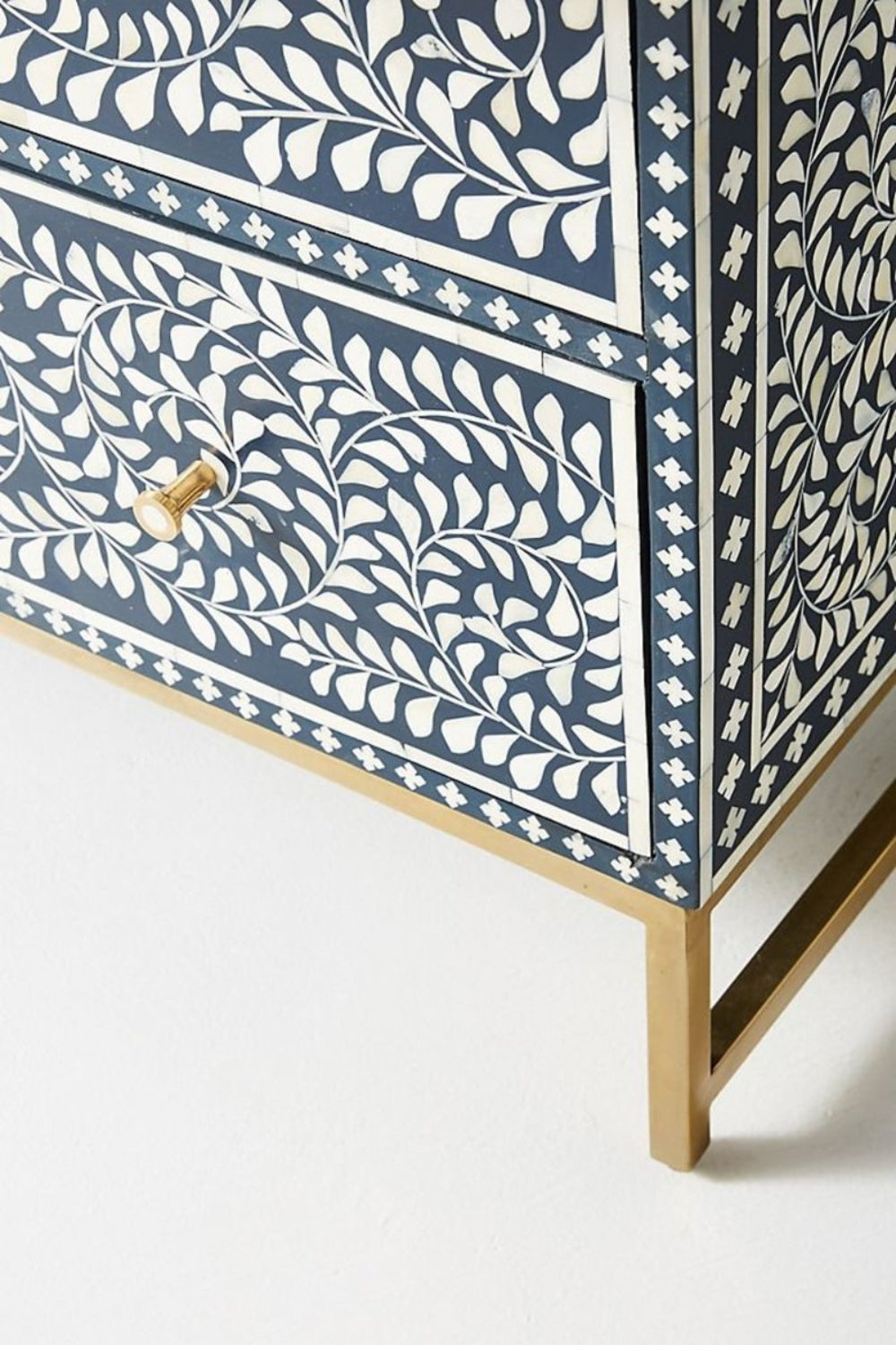 Metal Frame Lowboy in navy bone inlay shown from a side angle, revealing the slim frame and patterned drawer fronts.