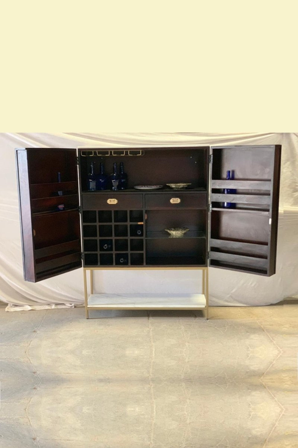 Handmade Bone Inlay Navy Blue Bar Storage Cabinet in front view, with floral doors, gold frame, and marble shelf