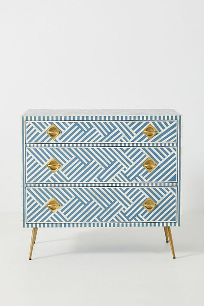 Optical Stripe Dresser in blue and white bone inlay, shown at a front angle with three drawers and legs.