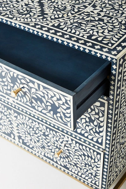 Patterned Navy Chest with bone inlay shown in a close-up of its spiral front, drawer pulls, and navy finish.
