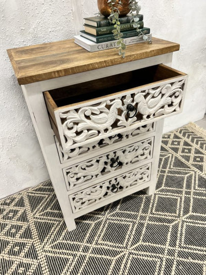 Peacock four-drawer bureau in rustic mango wood, open drawer view showing the wooden interior beneath a brown top.