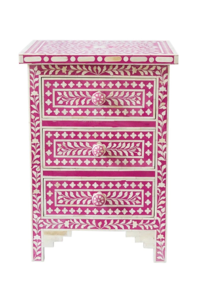 Pink and white bone inlay three-drawer bedside table with a floral vine pattern and matching knobs.