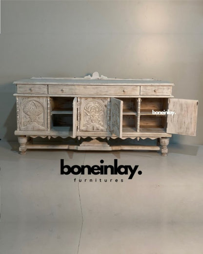 Rustic Carved Storage Buffet in distressed wood, front view with open cabinet doors revealing shelves beside animal panels.