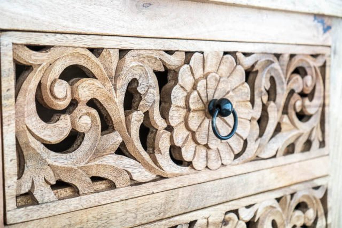 Rustic Ring Pull Dresser in pale natural wood, close-up of drawer handle surrounded by a carved flower and scrolling leaves.