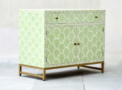 Sage green and white bone inlay scalloped cabinet with one drawer and two doors, gold metal frame