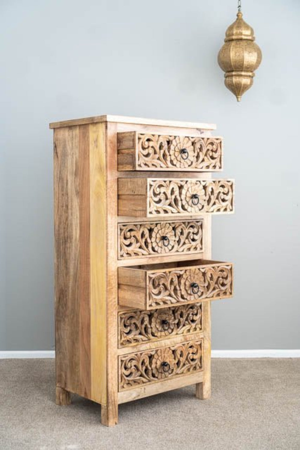 Six Drawer Storage Chest in natural wood, open drawer view showing three extended drawers with floral carving and ring pulls.