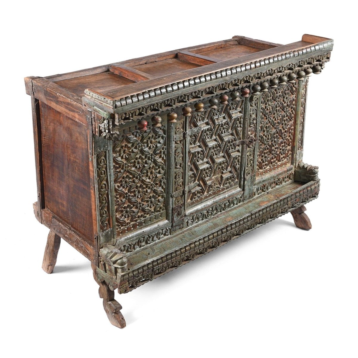 Solid wood Indian credenza, angled front view showing the plain left side, recessed top, carved facade and splayed feet.
