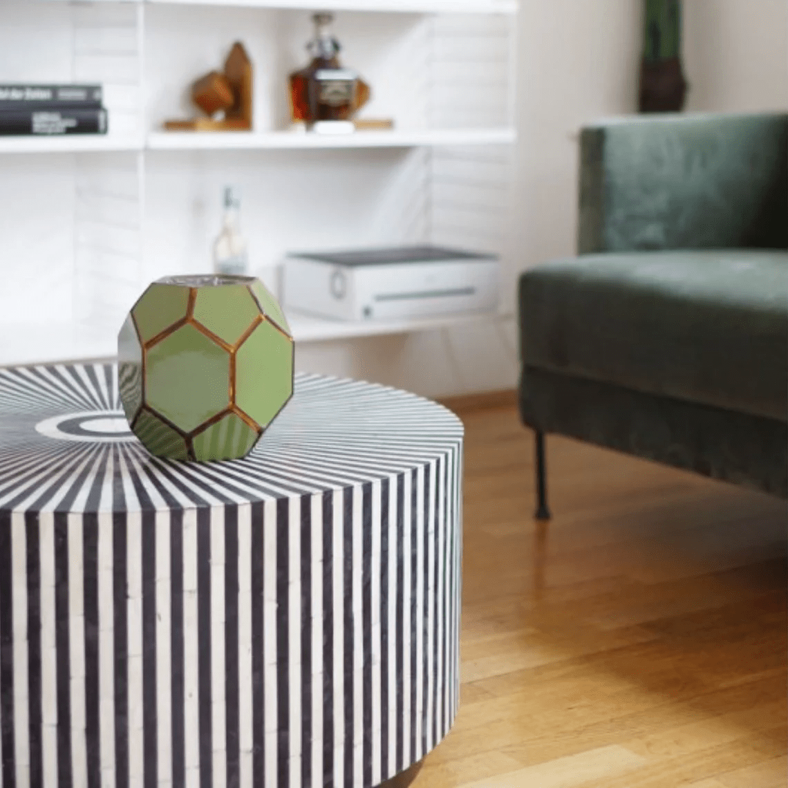 Black and white bone inlay coffee table displaying its round striped form in a full product view for home decor.