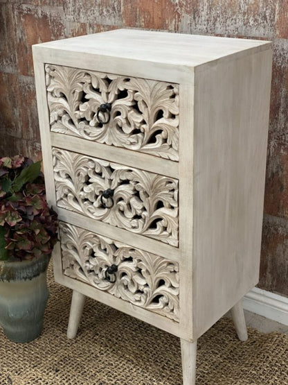 Three-drawer wooden bedside chest in a rustic finish, front view angled to show the plain right side and tapered legs.