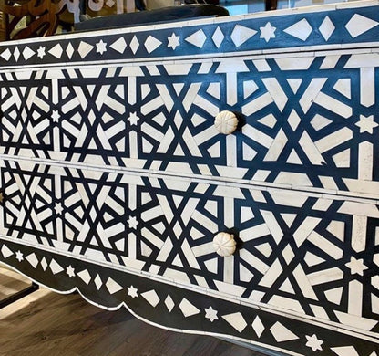 Two Drawer Inlay Credenza in black and white, shown close up from the front with round light-colored knobs.